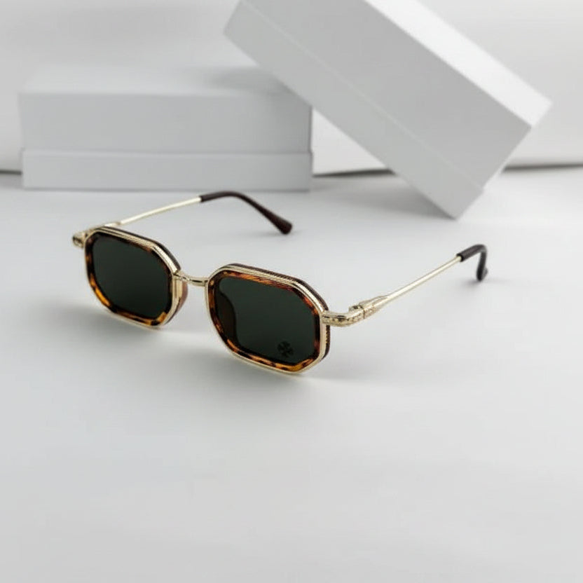 Sunglasses with gold frame and dark lenses on a white background