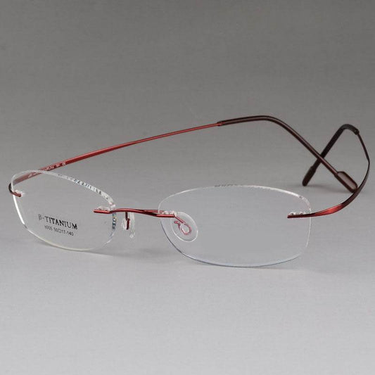 Sunglass Lover titanium rimless optical frame with rectangular clear lenses and red titanium temples