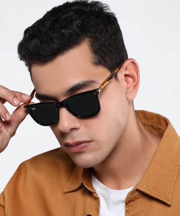 Sunglass Lover unisex wayfarer black sunglasses on male model with gold temples and matte black frame