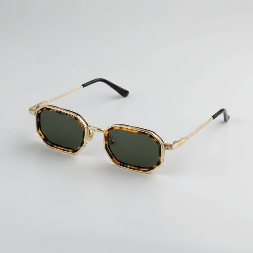 Sunglasses with tortoiseshell frame and dark lenses on a light gray background