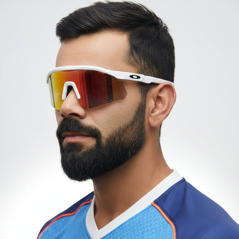 Man wearing reflective sunglasses and a blue sports jersey on a white background
