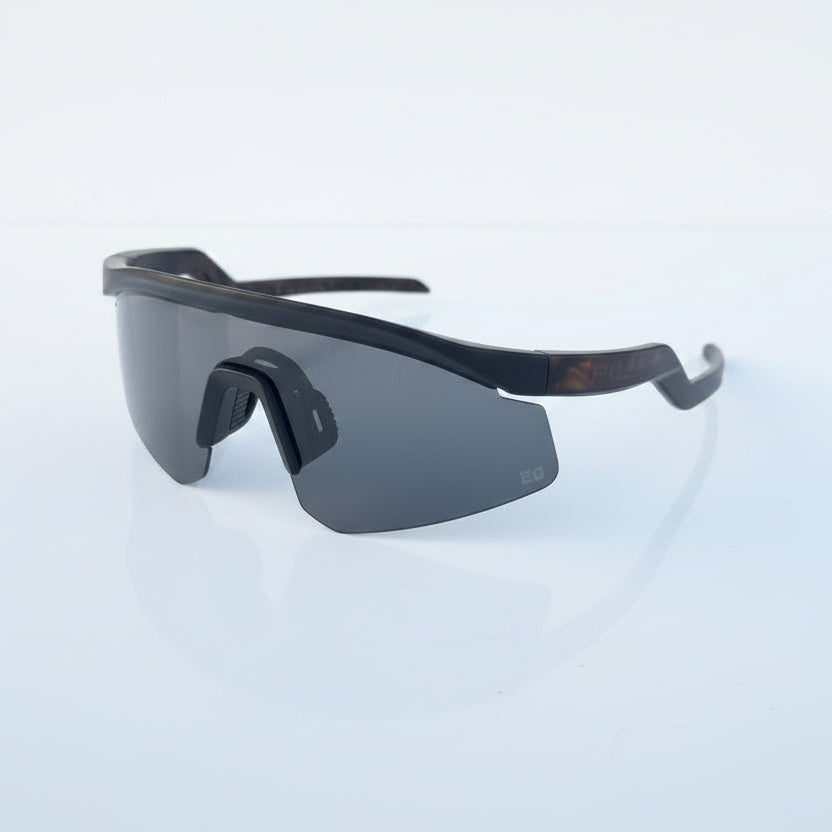 Black sunglasses packaging on a light surface