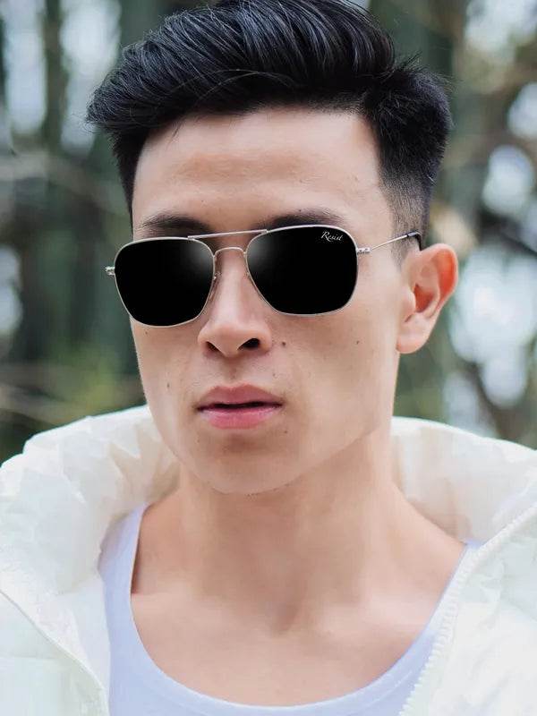 Sunglass Lover rectangle sunglasses for men with thin silver metal frame and black lenses on young male model