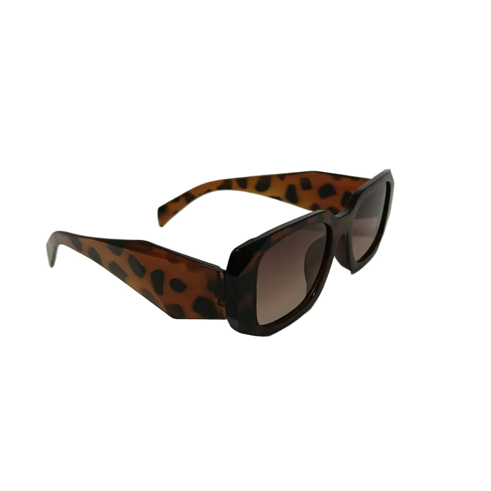 Sunglasses with leopard print frame on a light gray background