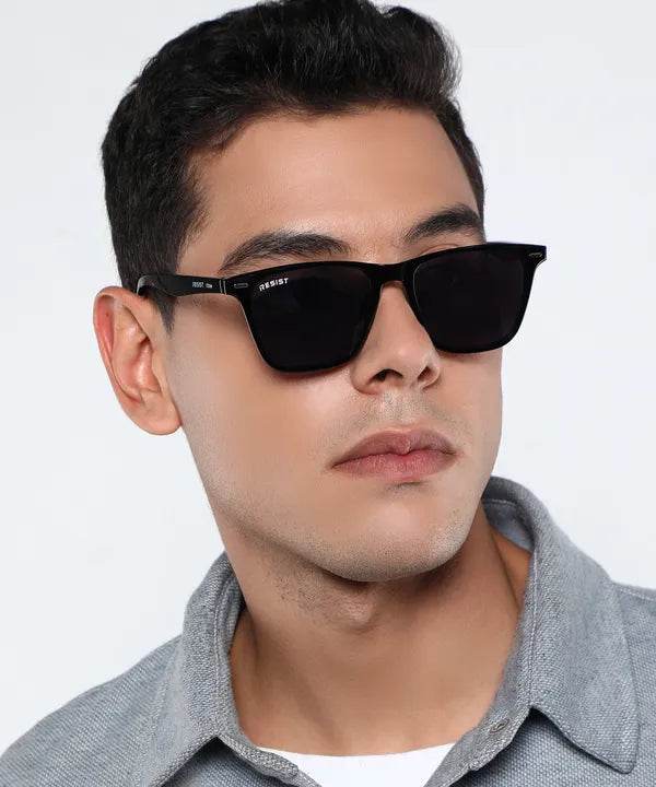 Man wearing Sunglass Lover black square sunglasses with dark lenses UV protection oval square sunglasses