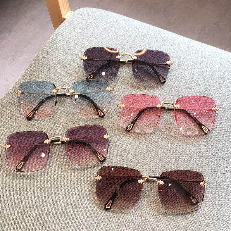 Sunglass Lover rimless oversize square sunglasses in mixed gradient colors with gold bridge and temples