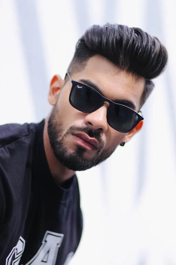 Sunglass Lover black wayfarer sunglasses for men and women shown on male model with dark hair