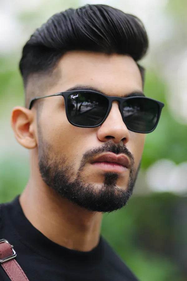 Man outdoors wearing black wayfarer sunglasses for men and women. Classic unisex frame from Sunglass Lover