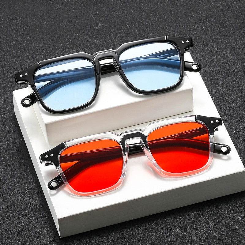 Sunglass Lover vintage square sunglasses two pairs black frame blue lenses and clear frame red lenses on white display