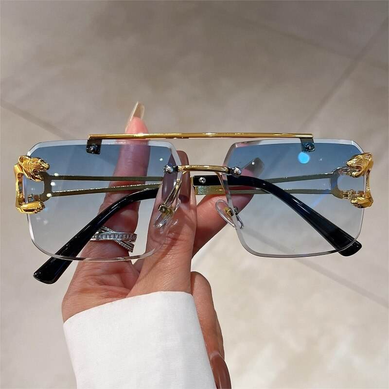 Sunglass Lover double bridge rimless sunglasses with blue gradient lenses and gold metal accents