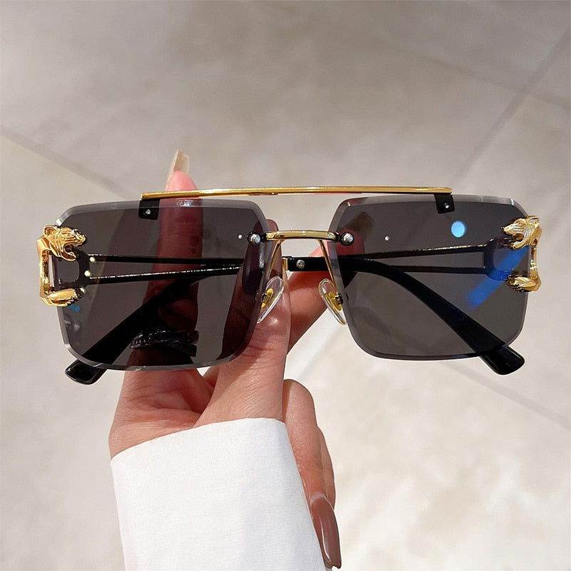 Sunglass Lover gold rimless sunglasses with dark lenses and lion head accents fashion rimless sunglasses trendy