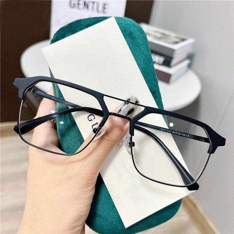 Sunglass Lover black square metal frames displayed with green case anti-blue light glasses for men