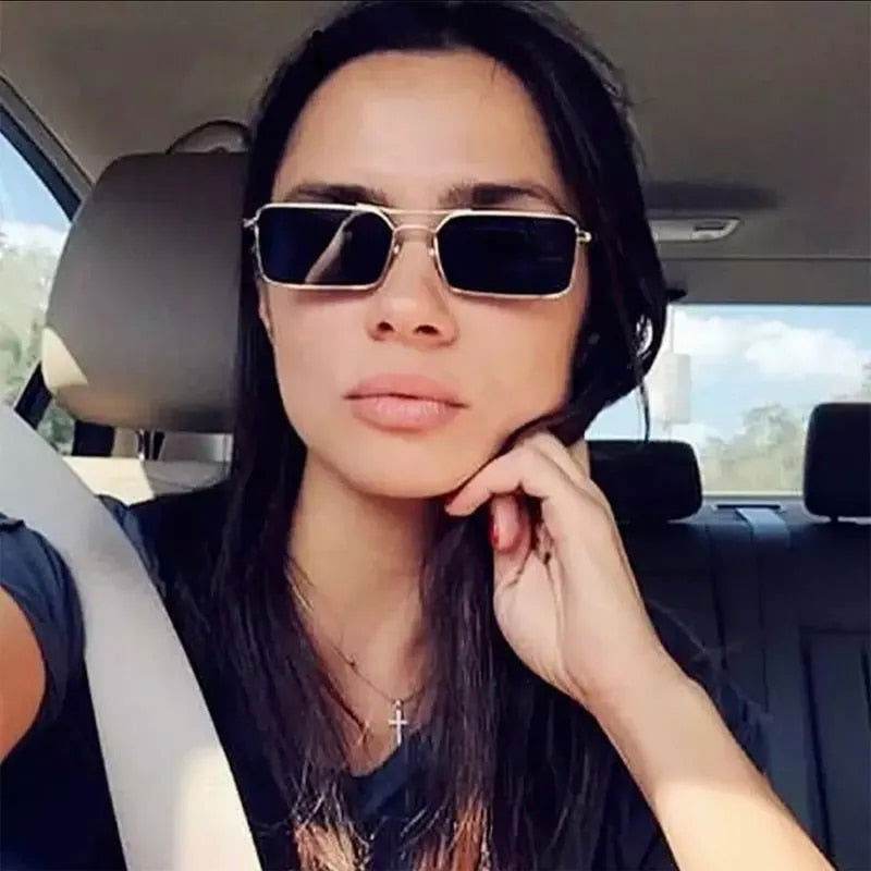 Sunglass Lover rectangular black and gold sunglasses on woman in car wearing seatbelt classic women's sunglasses online