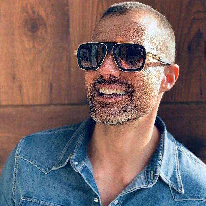 Sunglass Lover trendy pilot sunglasses with UV protection on a smiling man in a denim shirt