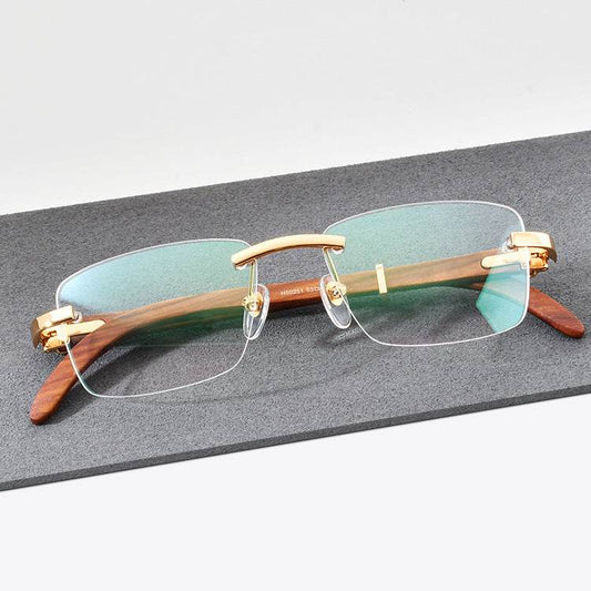 Sunglass Lover rimless Redwood temple eyeglasses with gold bridge and green anti glare lenses