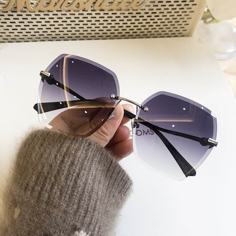Sunglass Lover oversized rimless sunglasses for women in purple gradient lenses with gold bridge