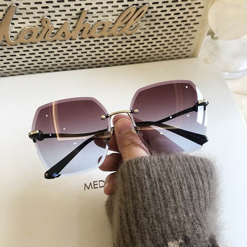 Sunglass Lover oversized rimless sunglasses for women purple gradient lenses gold bridge black temples