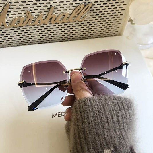 Sunglass Lover oversized rimless sunglasses for women purple gradient lenses gold bridge black temples