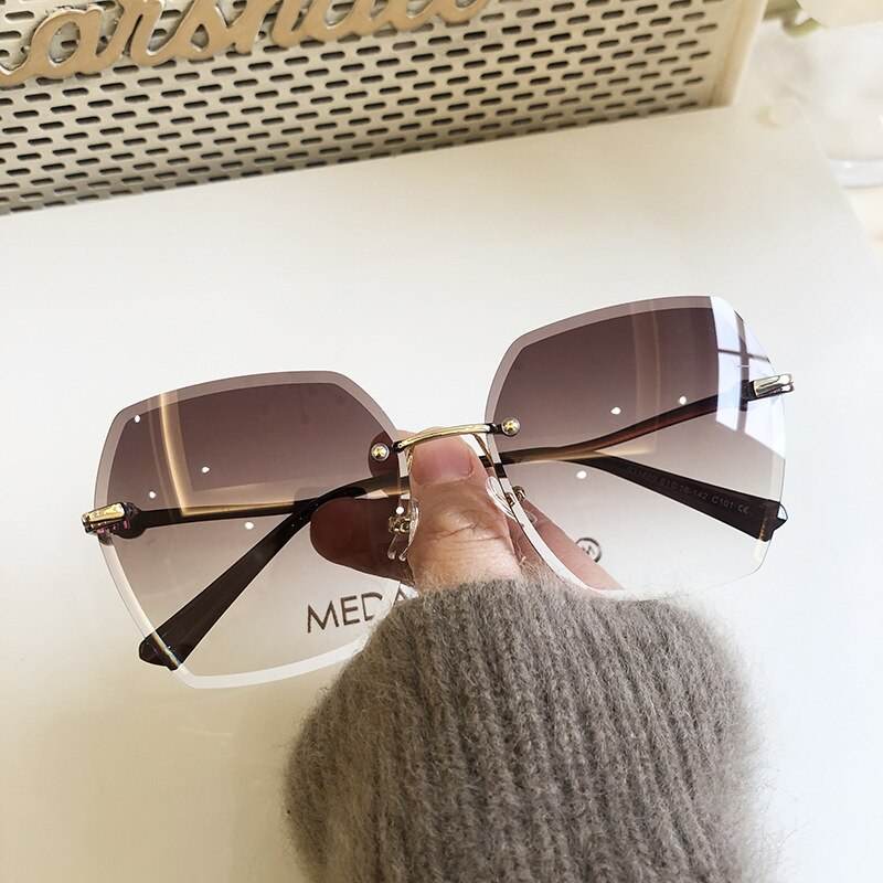 Sunglass Lover oversized rimless sunglasses for women with brown gradient lenses and gold bridge