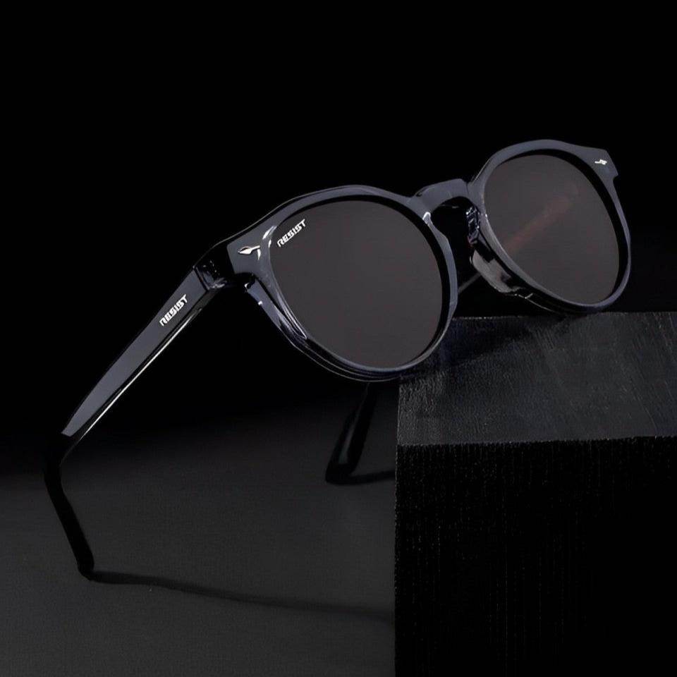 Sunglass Lover men's brown oval shades with translucent dark frames and UV protective lenses