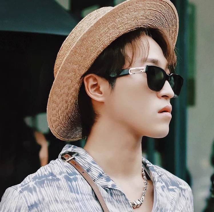 Sunglass Lover black sunglasses for men on young man wearing straw hat patterned shirt and silver chain