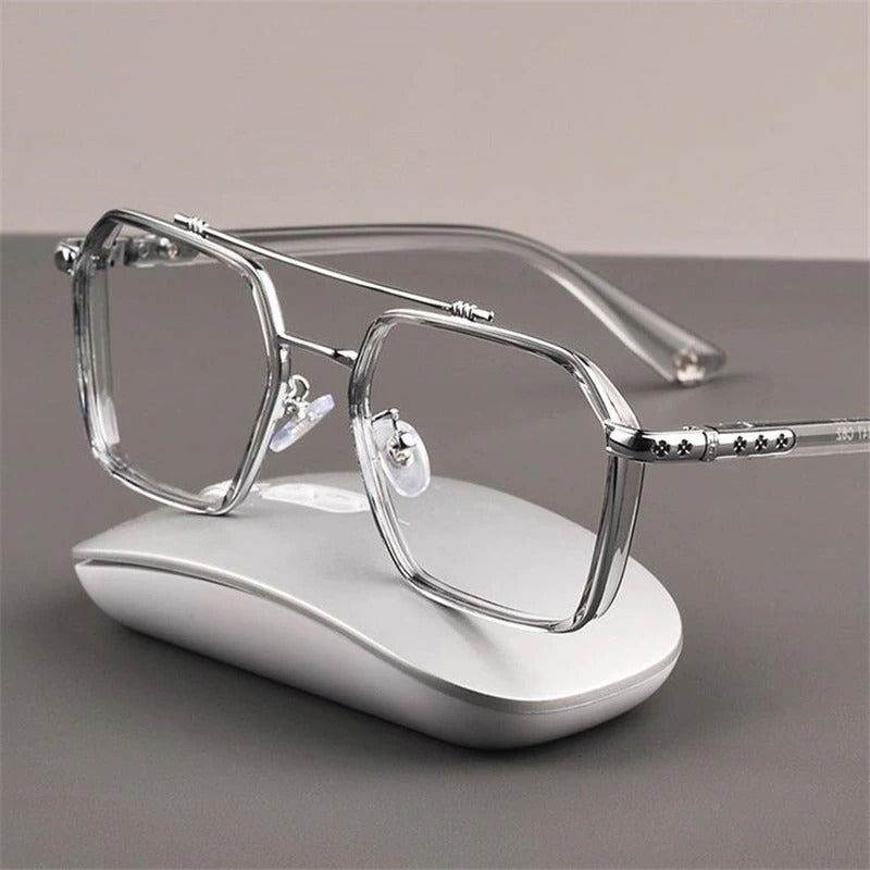Sunglass Lover oversized anti-blue eyeglasses clear geometric metal frame with nose pads resting on white mouse