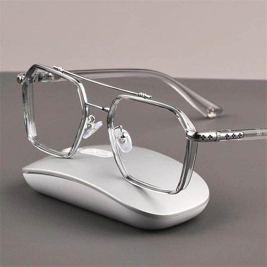 Sunglass Lover oversized anti-blue eyeglasses clear geometric metal frame with nose pads resting on white mouse