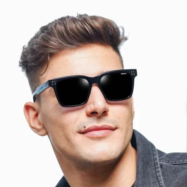 Sunglass Lover black square sunglasses for men worn by male model with matte black frame and dark lenses