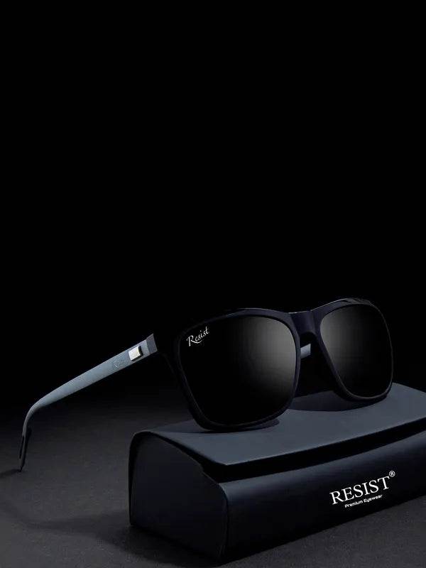 black wayfarer sunglasses resting on a black protective case with dark lenses and matte finish
