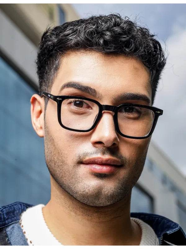 Man wearing Antiblue glasses from Sunglass Lover with clear black eyeglass frames and rectangular blue light lenses