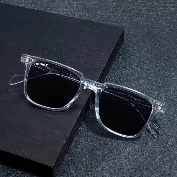 Sunglass Lover clear black wayfarer sunglasses with transparent frames and dark lenses on black textured surface