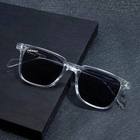 Sunglass Lover clear black wayfarer sunglasses with transparent frames and dark lenses on black textured surface