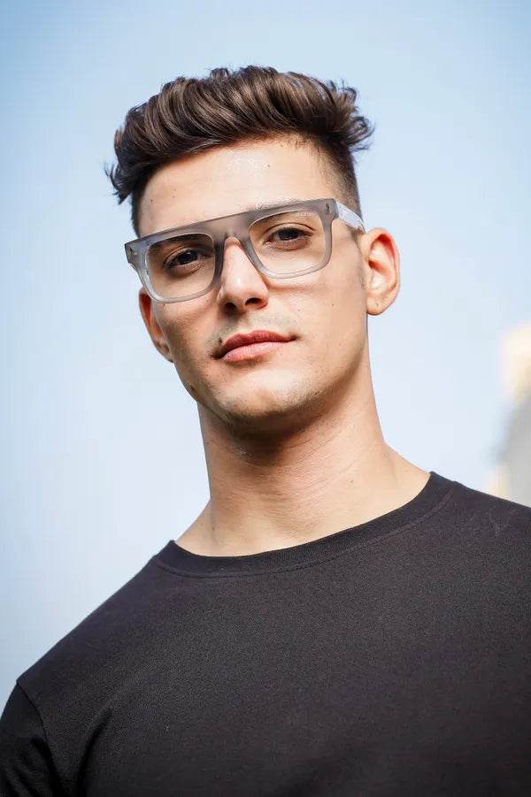 Sunglass Lover Antiblue eyeglasses on male model wearing clear square eyeglass frames with translucent gray lenses for blue light
