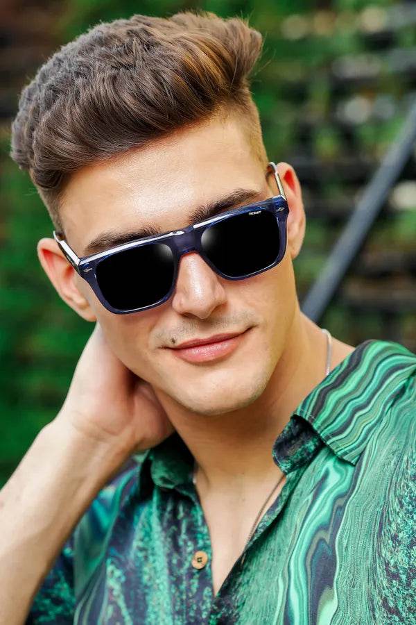 Young man wearing Sunglass Lover crystal blue wayfarer sunglasses with square frames and glossy finish