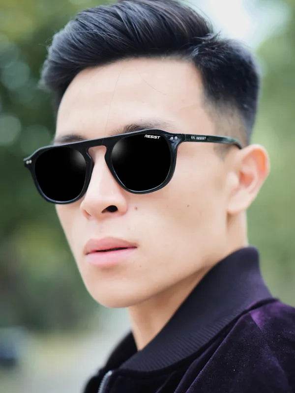 Sunglass Lover oval sunglasses worn by man outdoors featuring double bridge black sunglasses with UV protection