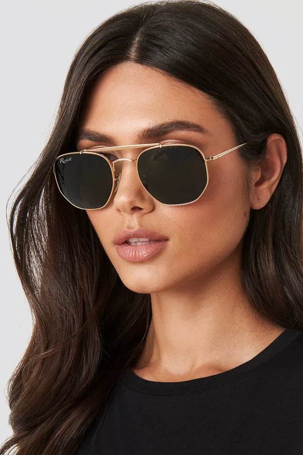 Sunglass Lover Octivia double bridge sunglasses gold hexagonal frame with black lenses on female model