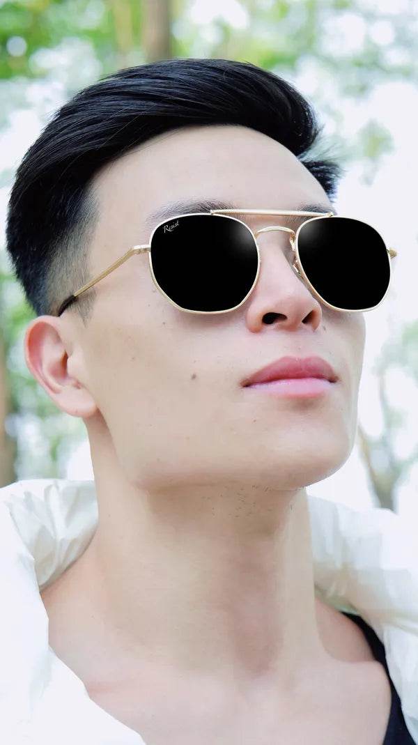 Male model wearing Sunglass Lover Octivia double bridge sunglasses gold hexagonal frame black lenses for outdoor style