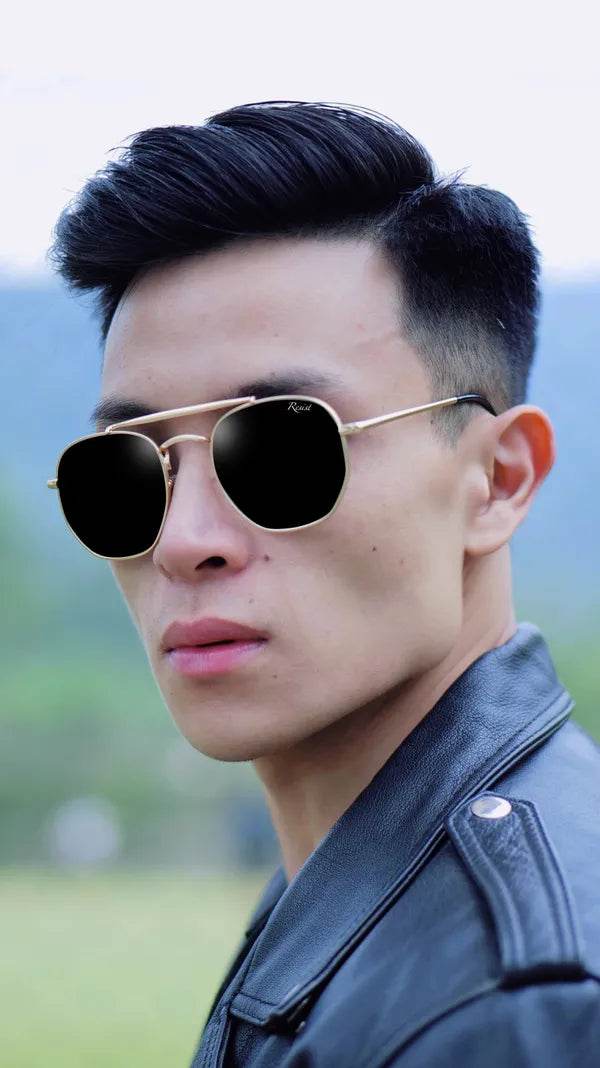 Sunglass Lover model wearing Octivia double bridge sunglasses gold hexagonal frame with black lenses