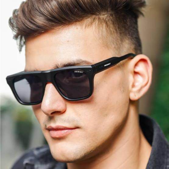Sunglass Lover Pioneer Square sunglasses black square frame on male model with dark polarized lenses