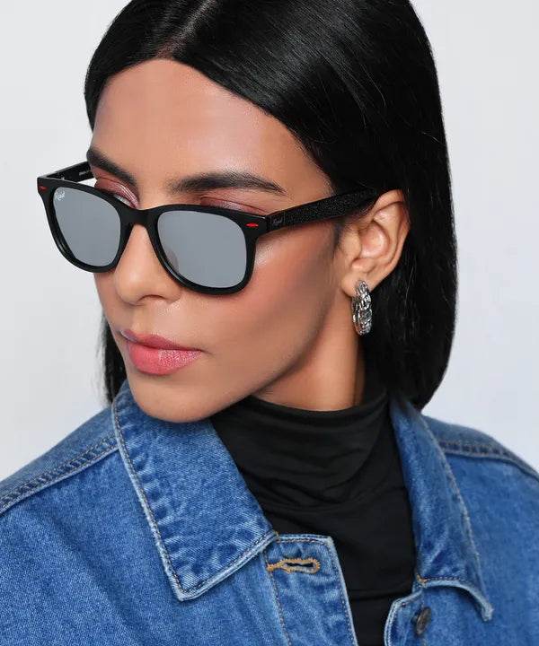 Sunglass Lover silver wayfarer sunglasses with mirrored silver lenses on woman wearing denim jacket