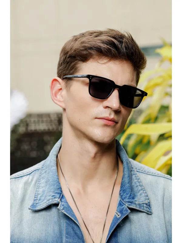 Sunglass Lover small black rectangle sunglasses on young man wearing denim jacket outdoors