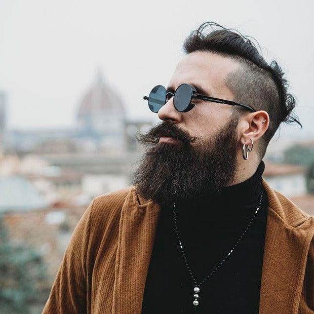 Sunglass Lover steampunk round sunglasses for men on bearded hipster wearing brown jacket and black turtleneck