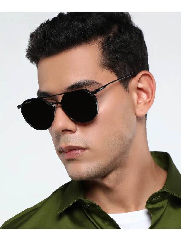 Male model wearing Stevan black oval glasses by Sunglass Lover with thin metal frame and dark lenses