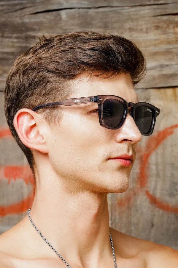 Sunglass Lover square sunglasses on male model side profile wearing storm grey black sunglasses