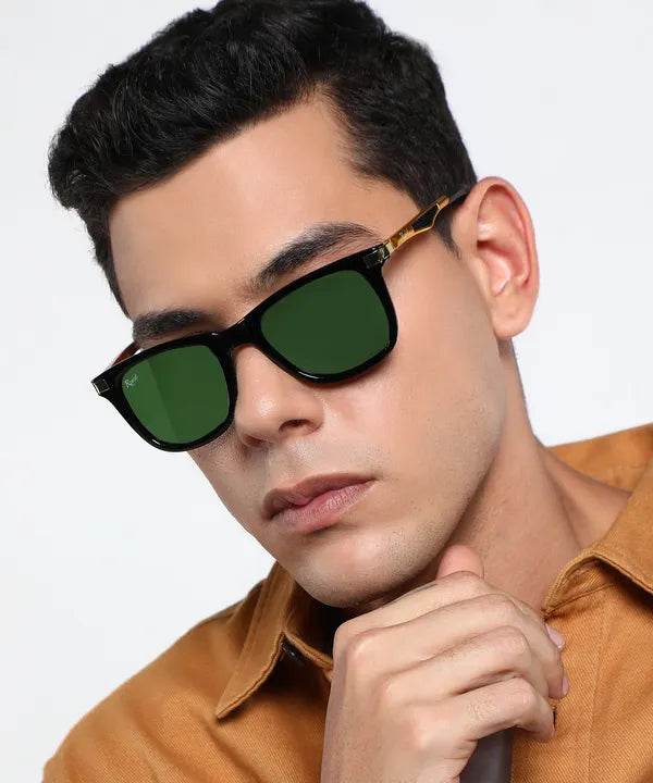 Sunglass Lover unisex wayfarer green sunglasses on male model wearing black tortoiseshell frame with polarized green lenses