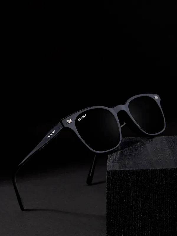 Sunglass Lover matte black UV protected square sunglasses with dark lenses displayed on black stand