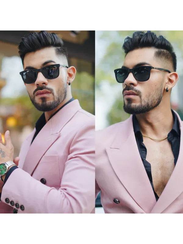 Stylish black wayfarer sunglasses for men shown on model in pink blazer with beard and gold chain