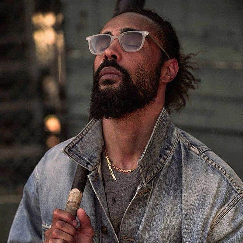 Sunglass Lover yellow clear eyeglass frames on bearded man wearing denim jacket and gold chain