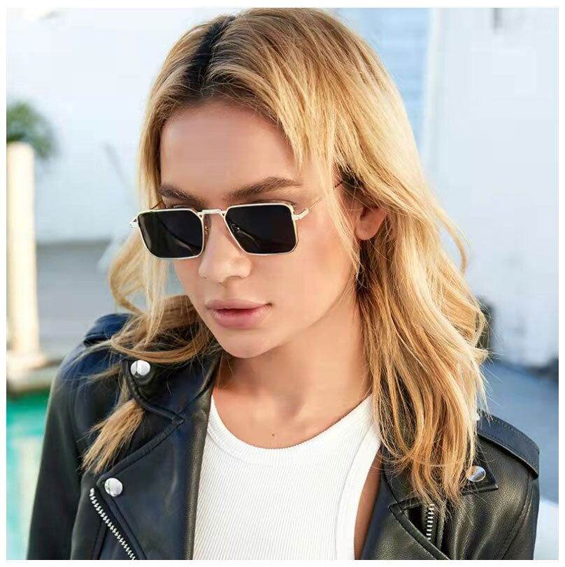 Sunglass Lover vintage rectangle sunglasses for men gold metal frame black lenses worn by model in leather jacket
