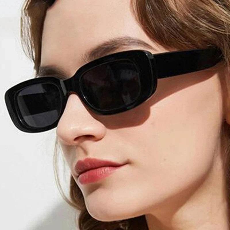 Jimmy Rectangle sunglasses by Sunglass Lover black rectangular frame on woman with dark lenses and glossy finish